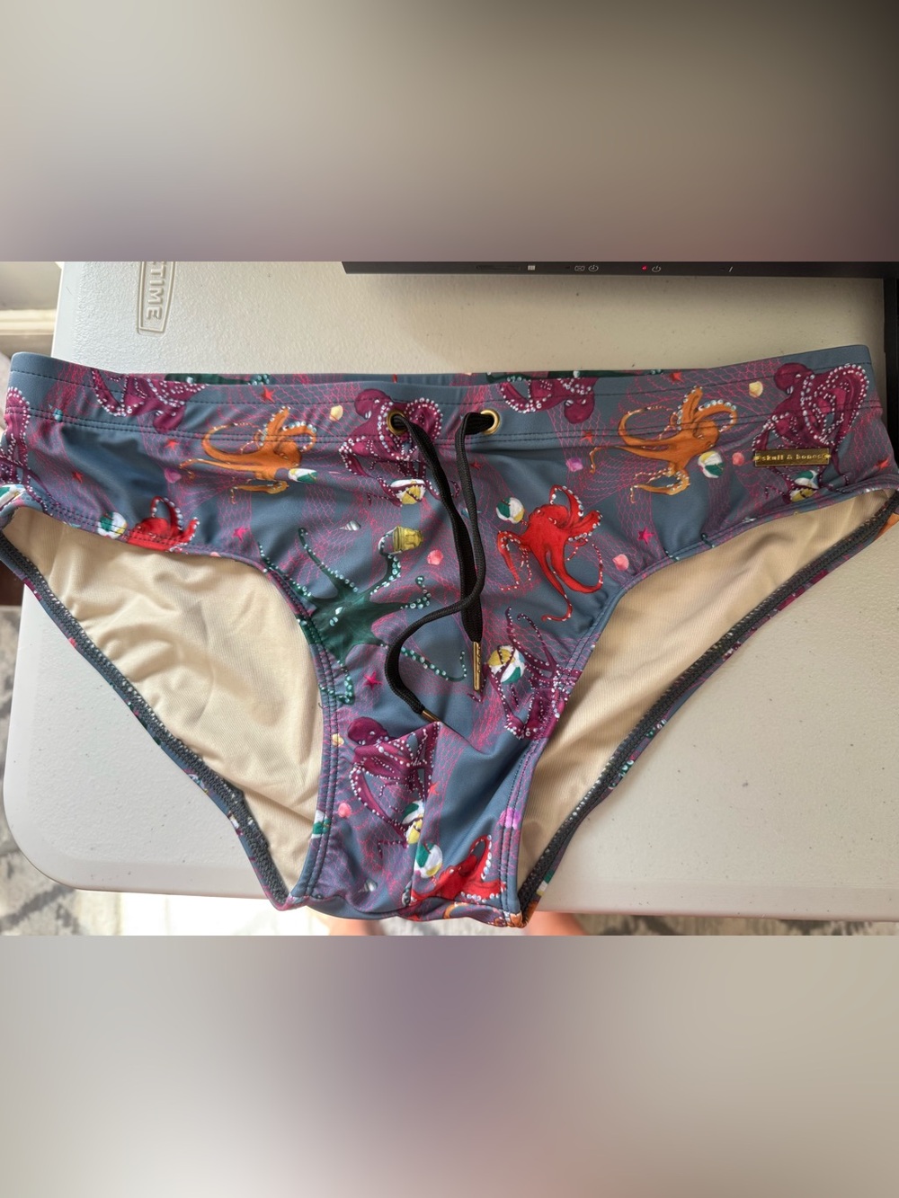 Men's Blue/Gray Skull & Bones Octopus Print Swim Briefs. Size Large
